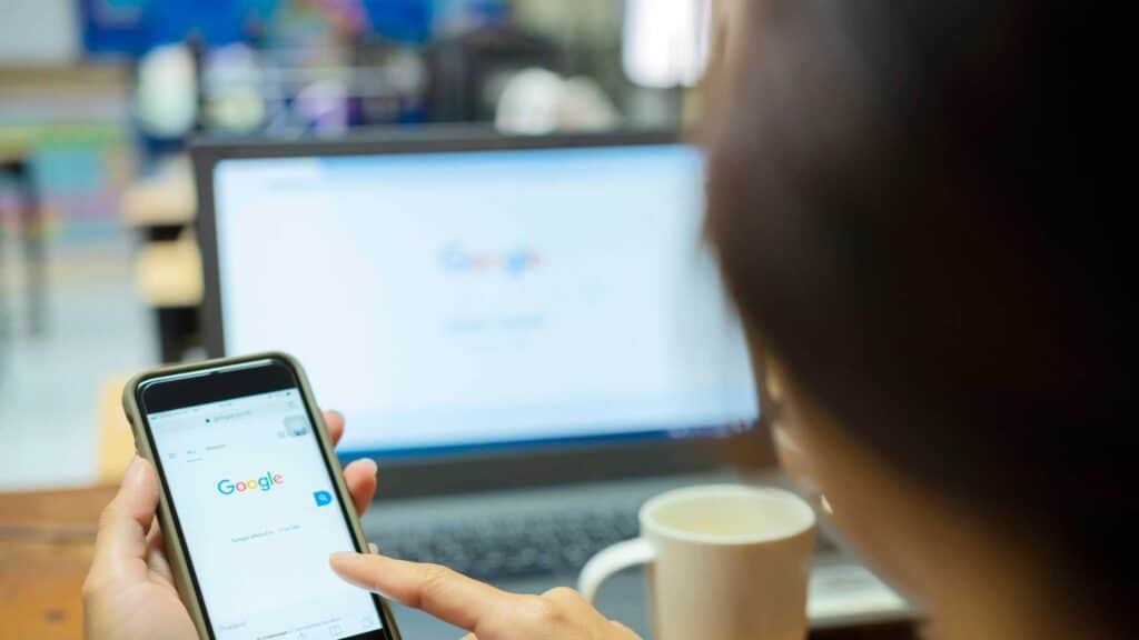 a girl typing something on google